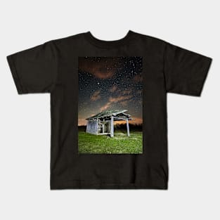 Shack on a meadow at night Kids T-Shirt